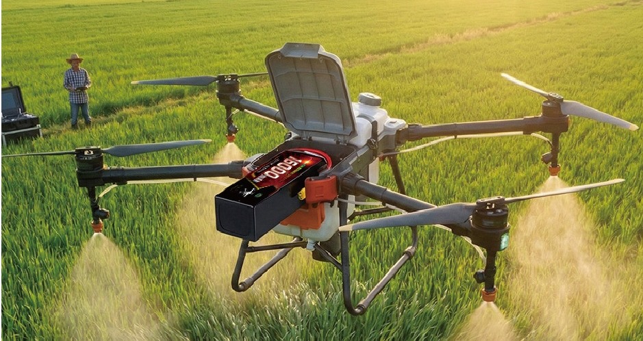 Agricultural spraying drone over farmland
